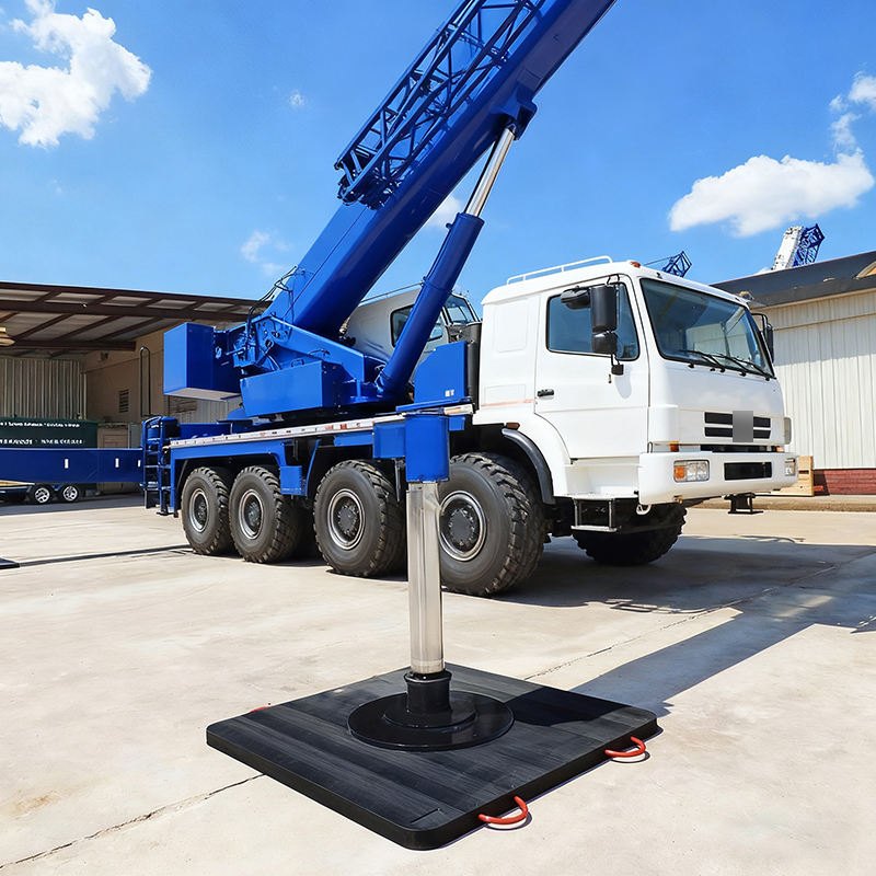 Truck crane outrigger resting on a square UHMWPE pad